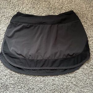 Lululemon skirt with built in liner. Cute mesh bottom and zip pocket in the back